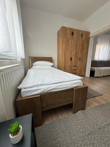 Ένα ή περισσότερα κρεβάτια σε δωμάτιο στο Apartman Pupi