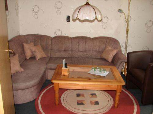 a living room with a couch and a coffee table at Hering in Grossenbrode
