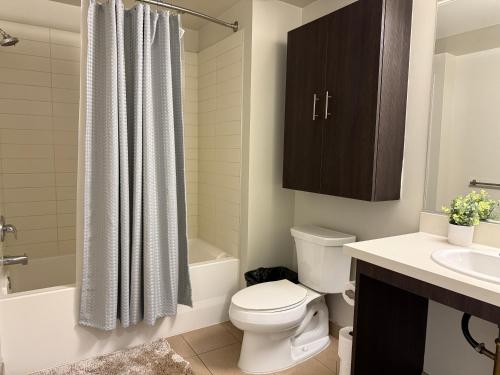 a bathroom with a toilet and a sink and a shower at Studio Suite - Walk to Convention Center and Crypto Arena in Los Angeles