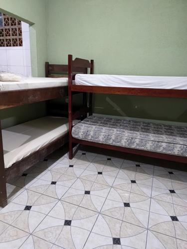 Postel nebo postele na pokoji v ubytování Casa do Jamail