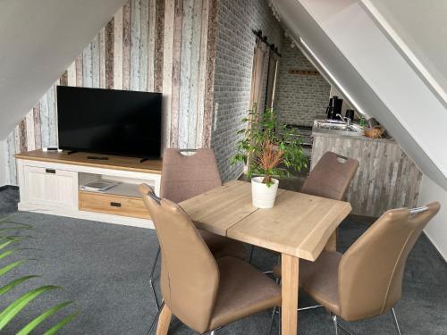 TV a/nebo společenská místnost v ubytování Meerblick 14