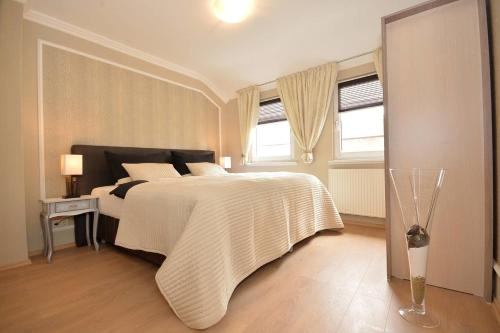 Un ou plusieurs lits dans un hébergement de l'établissement Business Apartments Bremen Typ 4