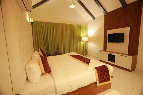 Postel nebo postele na pokoji v ubytování Dee Cottage kanyakumari