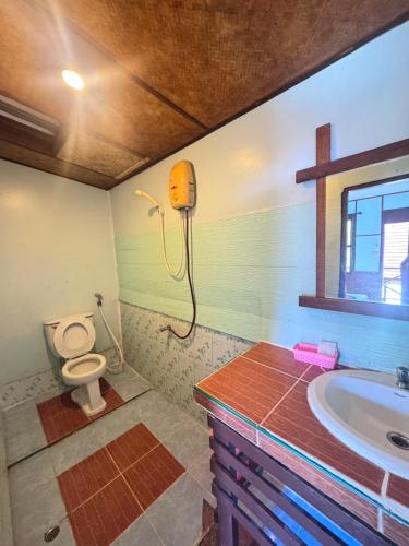 a bathroom with a sink and a toilet at Phi Phi Treetop in Phi Phi Don