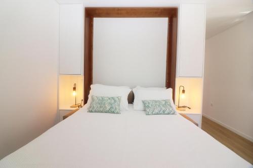 Ένα ή περισσότερα κρεβάτια σε δωμάτιο στο Quinta das Varcandas Gerês Apartamento 3 by Gerês Casas