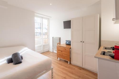 M22 studio avec balcon proche de la gare