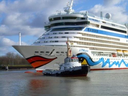 a cruise ship is docked in the water at Kleymann RE26 in Sögel
