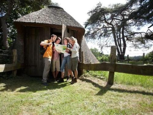 a group of people standing in front of a hut at Kleymann RE26 in Sögel