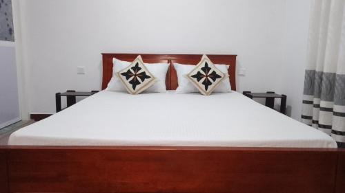 Postel nebo postele na pokoji v ubytování King Elephant, Homestay Pinnawala