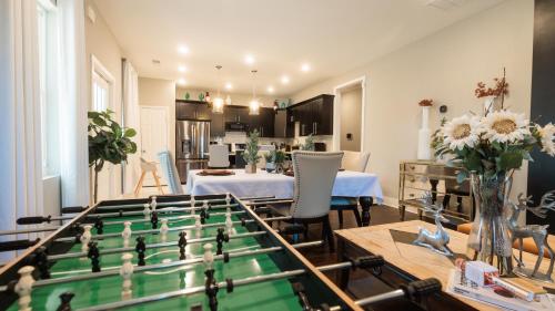 a living room with a table and a foosball at Cozy Room Queen Bed Private Bathroom Fast Wifi in Lithonia