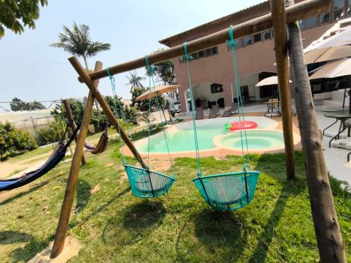 Kolam renang di atau dekat dengan Chácara Prainha JK com piscina praia no quintal de casa