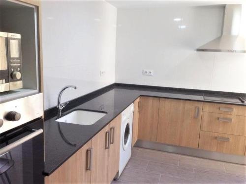 O bucătărie sau chicinetă la Vacansis Apartamento Pez Espada