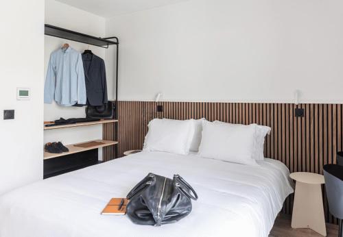 Postel nebo postele na pokoji v ubytování Appart Hotel Neostelia