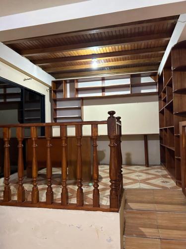 a wooden staircase in a house with a wooden ceiling at My home in Sucúa in Sucúa