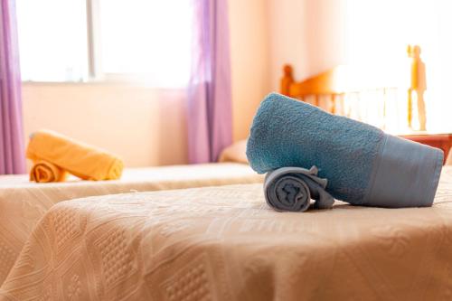 a toy car sitting on top of a bed at El nido de Cigüeñas in Cáceres
