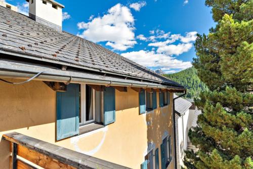 a house with windows on the side of it at Chesa Cromer - Celerina in Celerina