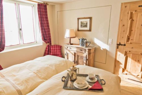 a room with a bed with a tray on it at Chesa Platz - Bever in Bever
