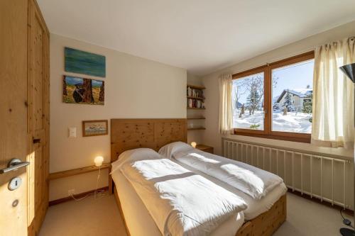 Ένα ή περισσότερα κρεβάτια σε δωμάτιο στο Chesa Staz - Pontresina