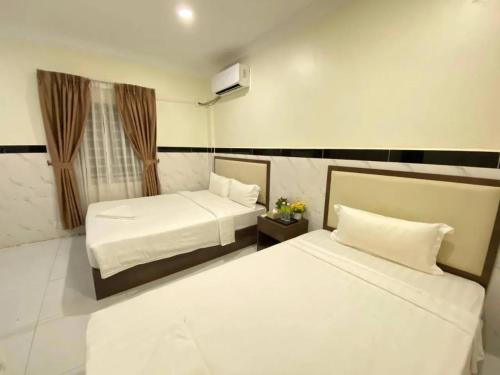 Katil atau katil-katil dalam bilik di AHHA Residence Kampot
