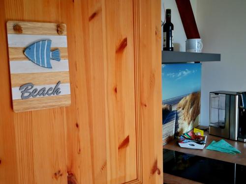 TV a/nebo společenská místnost v ubytování Gästehaus Nord-West 1700 - Doppelzimmer Beach