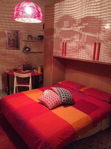 a bedroom with a bed with two pillows on it at A casa di mamma in Rieti