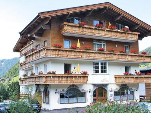 a large building with balconies and flowers on it at Apartment in Kitzbühel Alps with Wellness Area in Wildschönau