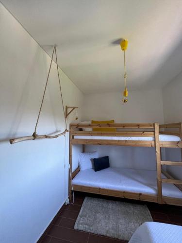 a bedroom with two bunk beds in a tent at Assossego House - Gerês in Geres