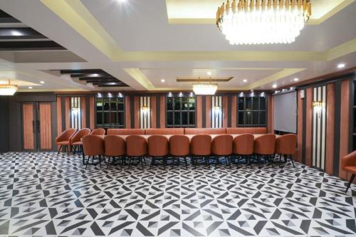 a conference room with a bunch of chairs in it at Hotel Square 36 in Kota