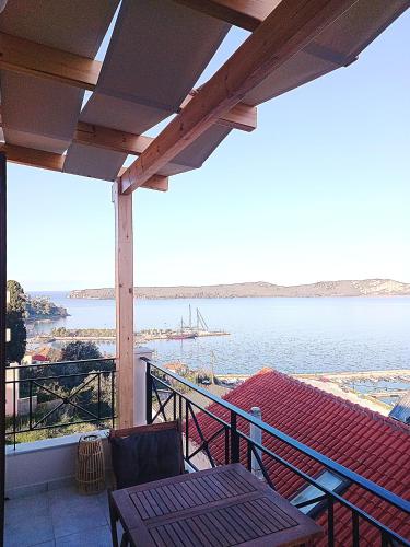 a balcony with a view of a body of water at Bay blue in Pylos