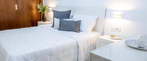 En eller flere senge i et værelse på Estancia Sofia