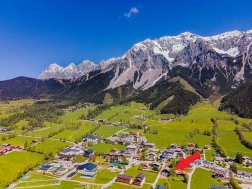 an aerial view of a resort in the mountains at Bergidyll 12 by Alpenidyll Apartments in Ramsau am Dachstein