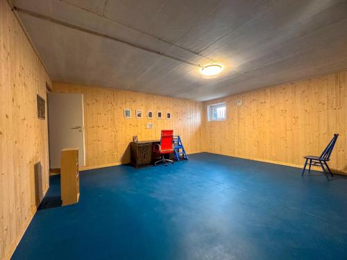 an empty room with chairs and a table in it at Appartamento a due passi dal lago con box in Dorio