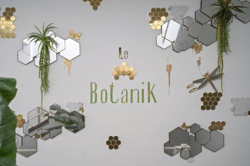 a wall with a sign that says botank at Tropical Chic Immeuble Le Botanik in Fort-de-France