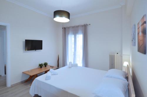 A bed or beds in a room at A heart apartment at Skouze Hill, Dirrachiou