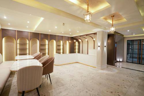 a conference room with a table and chairs in it at Hotel Square 36 in Kota