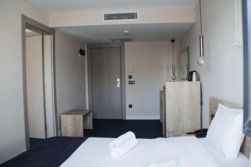 Katil atau katil-katil dalam bilik di Bohem Hotel