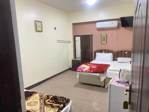 Llit o llits en una habitació de Durrat Ali Karbala