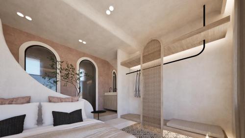 a bedroom with a white bed and a window at Atlantic Island Suites in Astypalaia Town