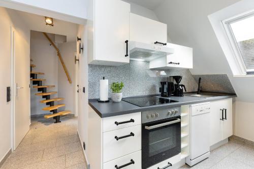 Kuchyň nebo kuchyňský kout v ubytování Appartement Tina Kieler Straße 16a APPARTO Grömitz