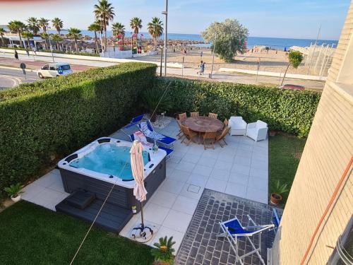 an overhead view of a patio with a hot tub and a table at il Sorriso di Angelina in Pescara