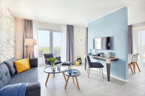 Khu vực ghế ngồi tại 3-Raum-Ferienwohnung mit Meerblick,