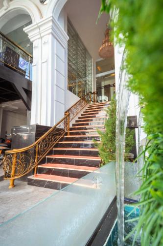 a set of stairs in a building with a fountain at V.I.P BOUTIQUE HOTEL in Vientiane