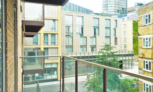 a balcony with a view of a building at Spacious & Elegant Apartments in Southbank near London Eye in London