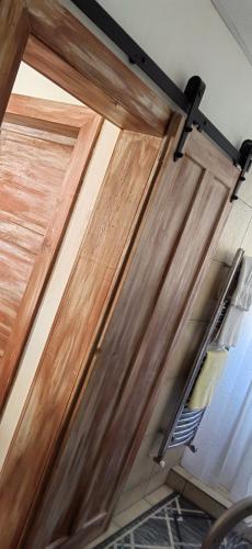 a wooden garage door with a light hanging from it at Ondrašovská skala in Ondrašová