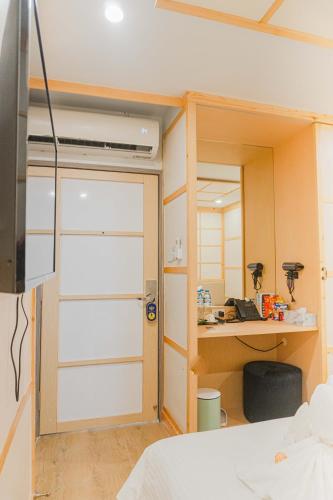 a room with a closet with a sliding door at V.I.P BOUTIQUE HOTEL in Vientiane