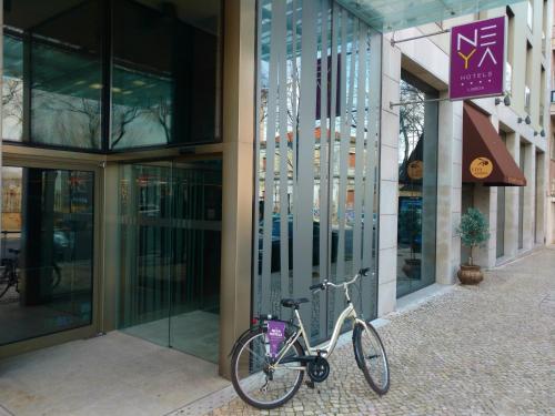a bicycle parked in front of a building at NEYA Lisboa Hotel in Lisbon