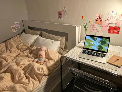 a baby bed with a laptop computer on it at stay bnb 206 in Seoul
