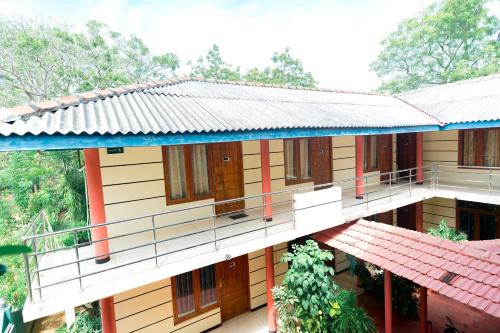 a building with a walkway in front of it at The Coastal Hotel in Trincomalee
