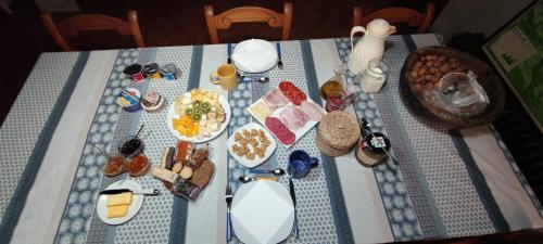 a blue and white table with food on it at Etxatoa in Odériz