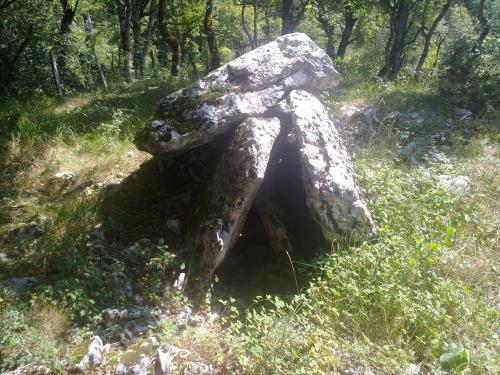 a large rock sitting in the middle of a field at Etxatoa in Odériz